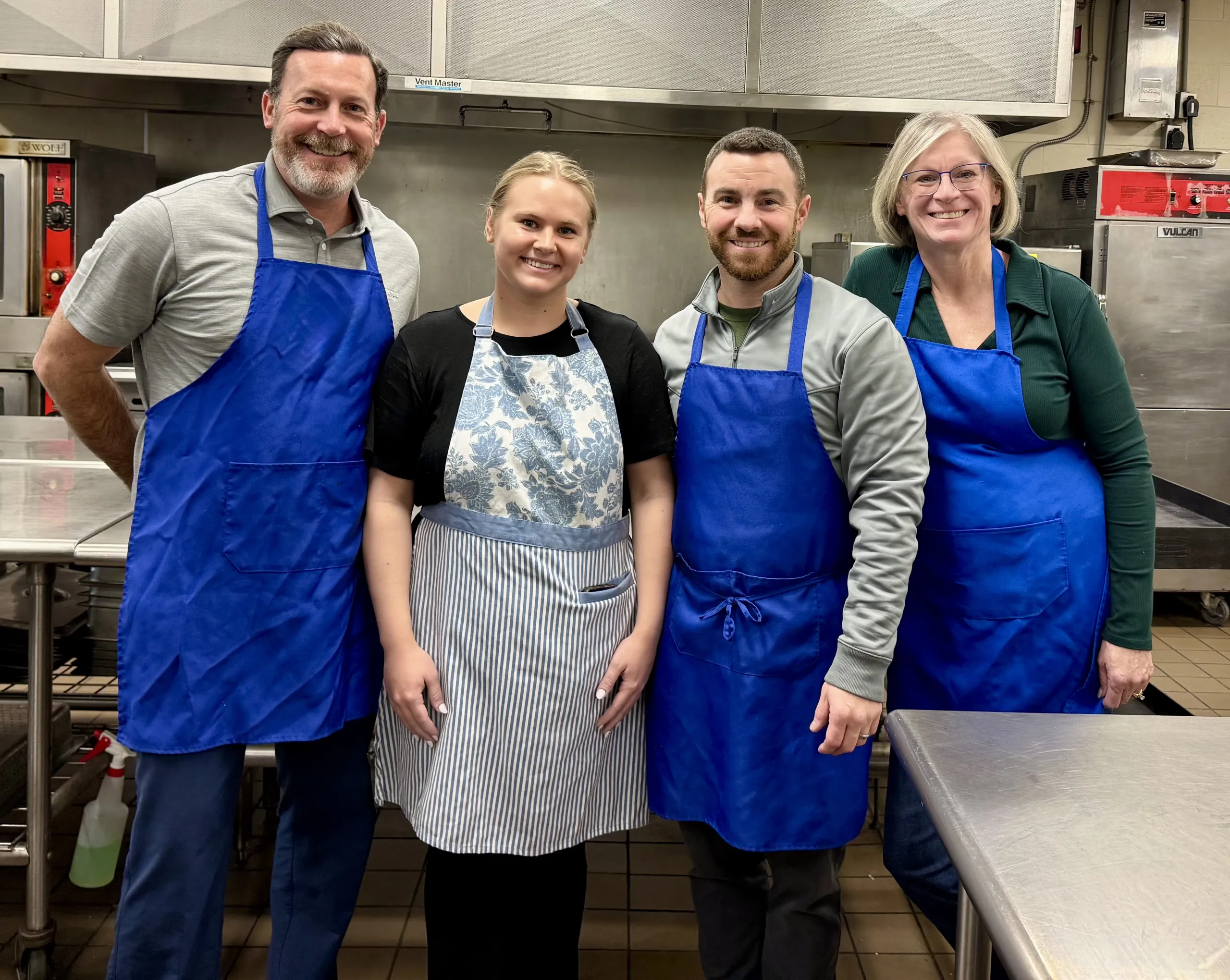 PWM staff volunteering in a kitchen.